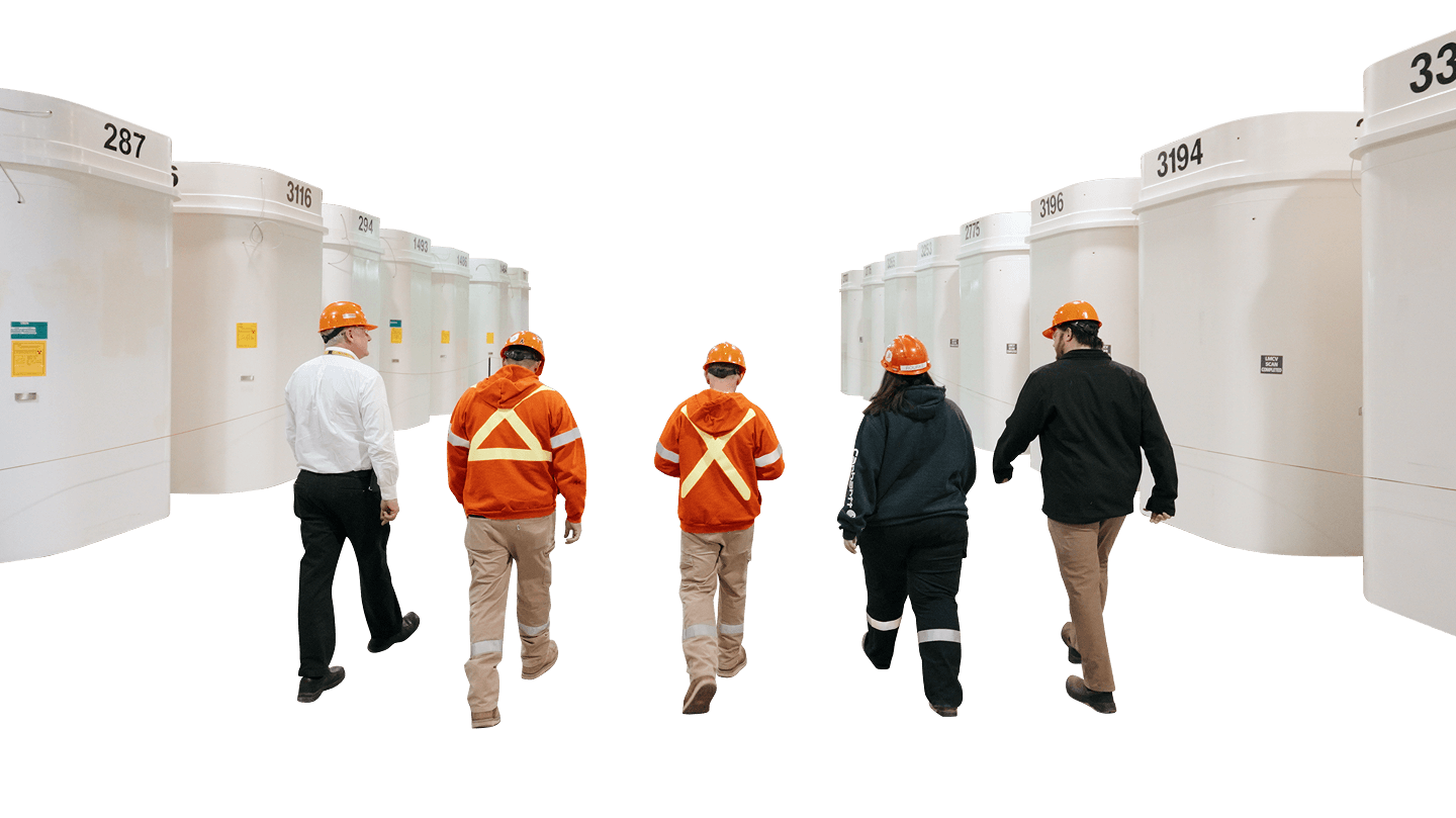 Rectangle 547 (1) Image: OPG employees with high-level nuclear waste containers.